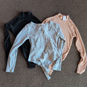 Three (3) Ribbed Long Sleeve Bodysuits in Black, Gray, and Tan Sz Medium EUC